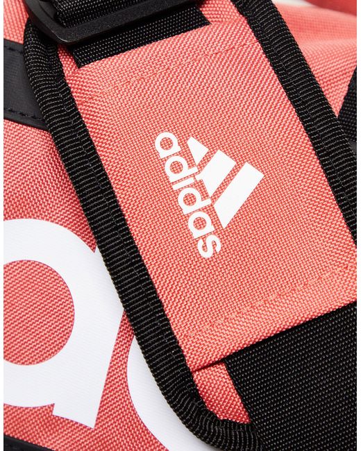 Adidas training - borsone extra piccolo corallo di Adidas Originals in Red