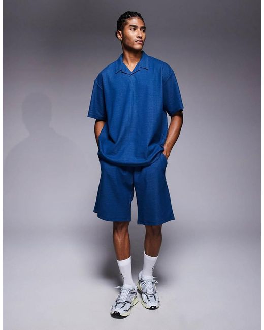 ADPT Blue Split Neck Texture Polo Shirt for men