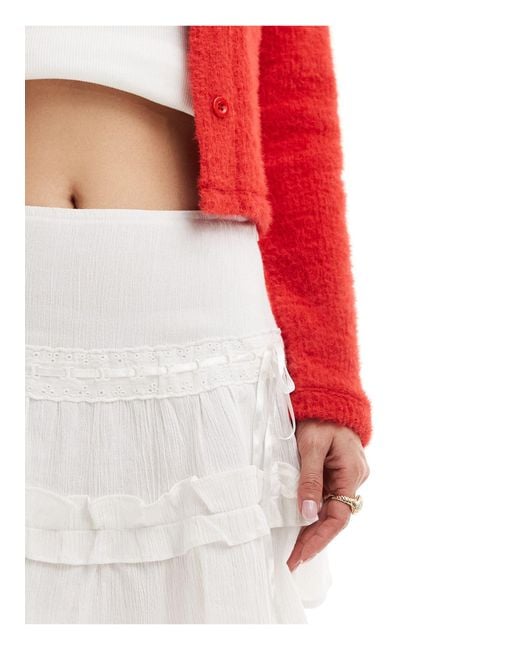 Mini-jupe en coton effet froissé à volants avec rubans Collusion en coloris White