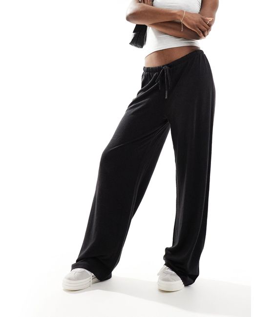 Pantalon taille basse effet lin ASOS en coloris Black