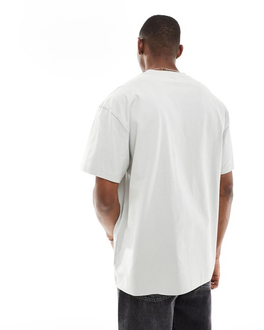 T-shirt oversize grigia con grafica stampata di Weekday in White da Uomo