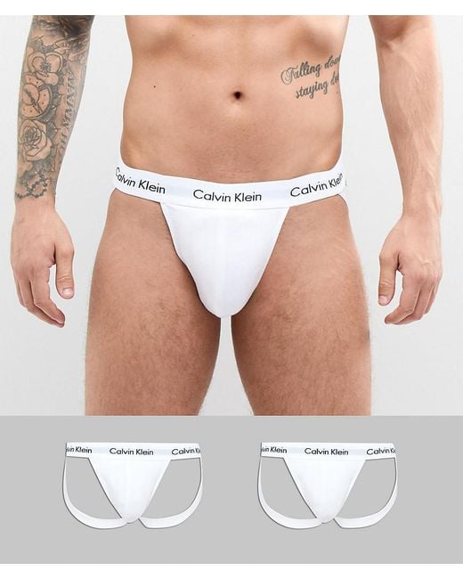 Lot de 2 strings fesse nue en coton stretch Calvin Klein pour homme en coloris White