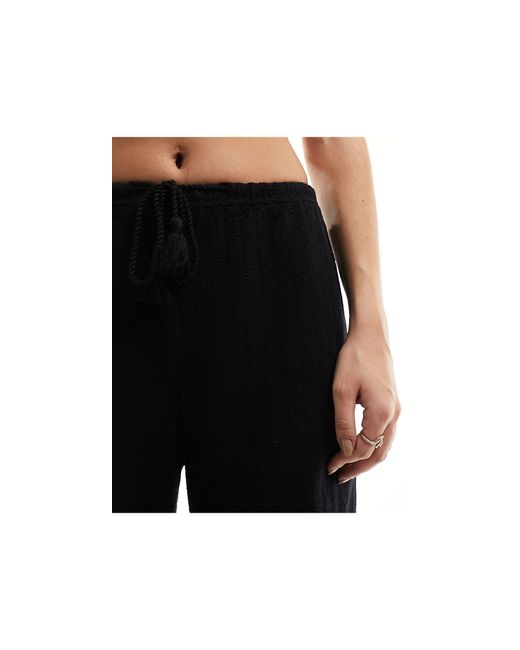 Pantaloni da mare lunghezza integrale neri di Iisla & Bird in Black