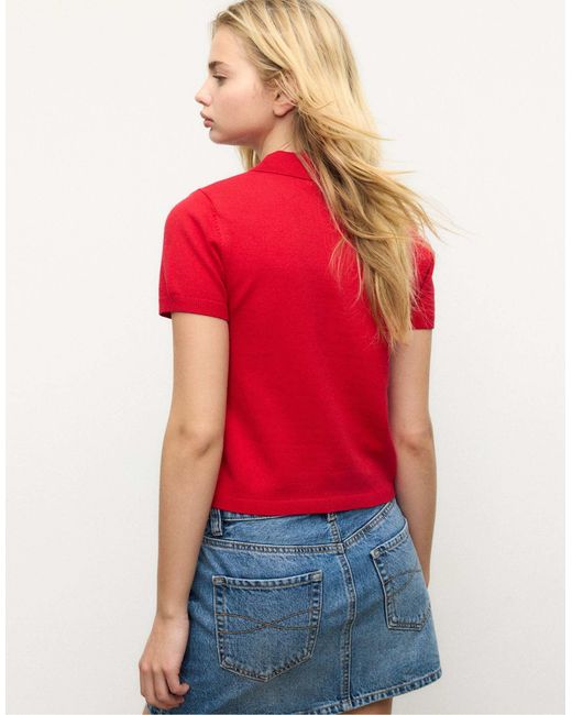 Pull à manches courtes en maille avec col polo Stradivarius en coloris Red