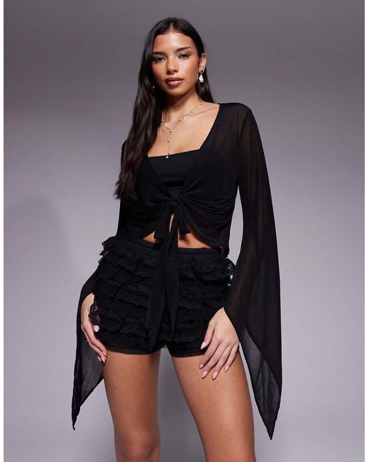 The Frolic Black Exclusive Sheer Chiffon Flare Sleeve Plunge Tie Front Top