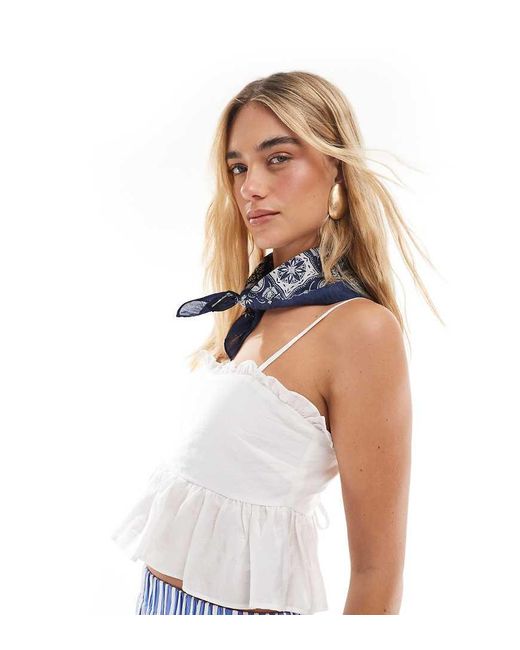The Frolic White Exclusive Ruffle Trim Tie Back Babydoll Cami Top