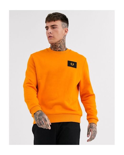 Fred Perry – es Sweatshirt mit Logo-Aufnäher in Orange für Herren