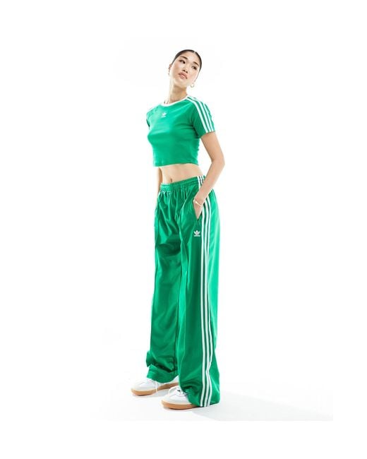 Firebird - pantaloni sportivi verdi di Adidas Originals in Green