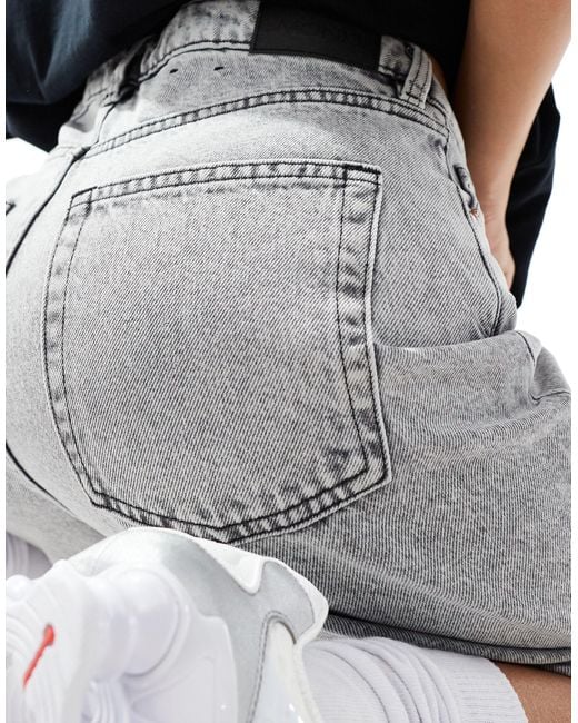 Paige - jupe culotte ample en jean à taille basse - délavé Monki en coloris Gray