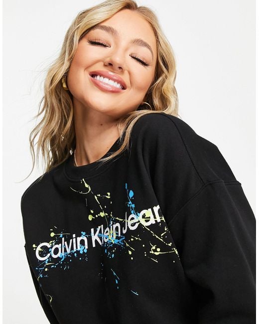 Calvin Klein Denim Splattered Overlay Logo Crew Neck Sweater in Black ...