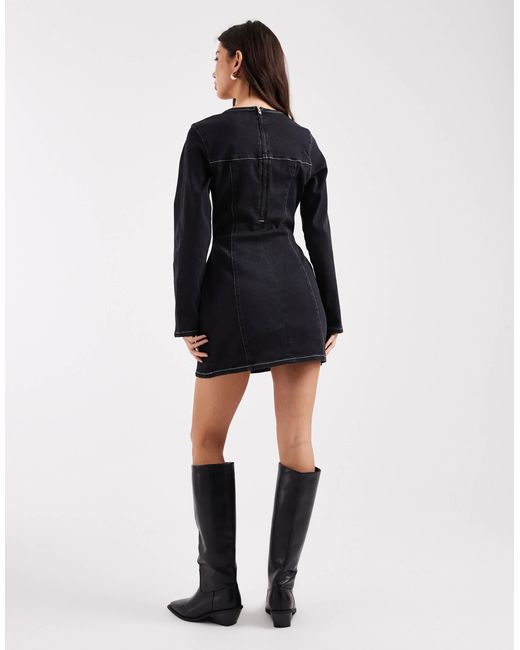 Robe courte structurée en jean avec taille cintrée et manches longues ASOS en coloris Black