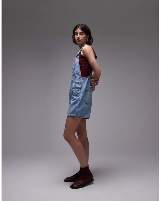 Salopette courte style utilitaire - bleu clair délavé Levi's en coloris Blue