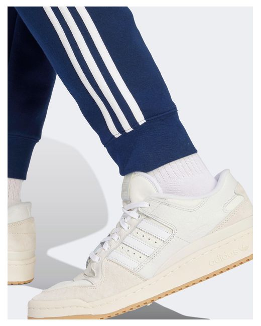 Adidas Originals Blue 3 Stripes Track Pants for men