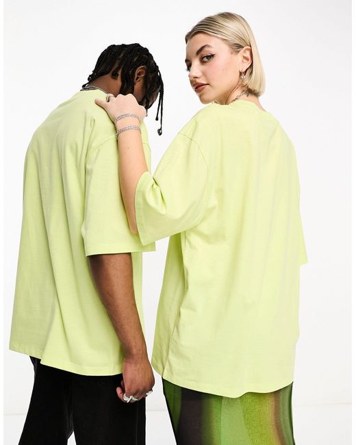Unisex - t-shirt verde lime con logo specchiato di Collusion in Yellow
