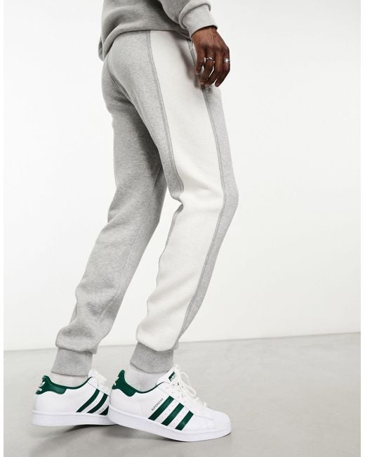 Adidas Originals White Essentials+ Small Logo Cut And Sew Trackies for men