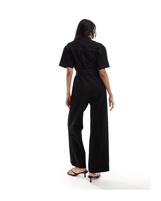 Tuta jumpsuit elasticizzata a fondo ampio nera con allacciatura di & Other Stories in Black