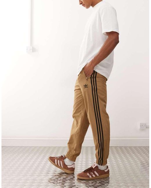 Adidas Originals Natural Firebird Track Pants for men
