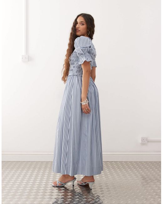 Robe mi-longue en coton à rayures avec manches bouffantes Amy Lynn en coloris Blue