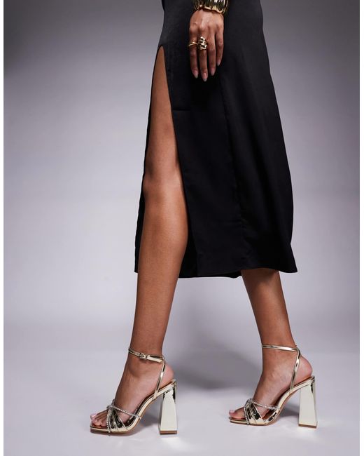 SIMMI Metallic Simmi london – ilara – riemchensandalen mit mittelhohem blockabsatz und verzierung