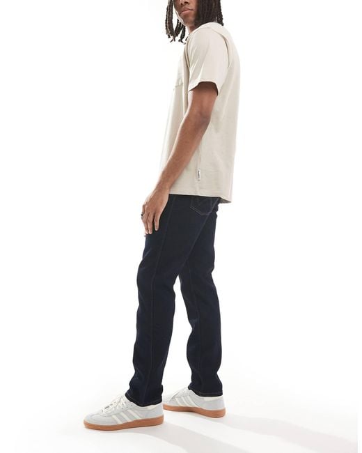 Wrangler – larston – schmale karottenjeans in White für Herren