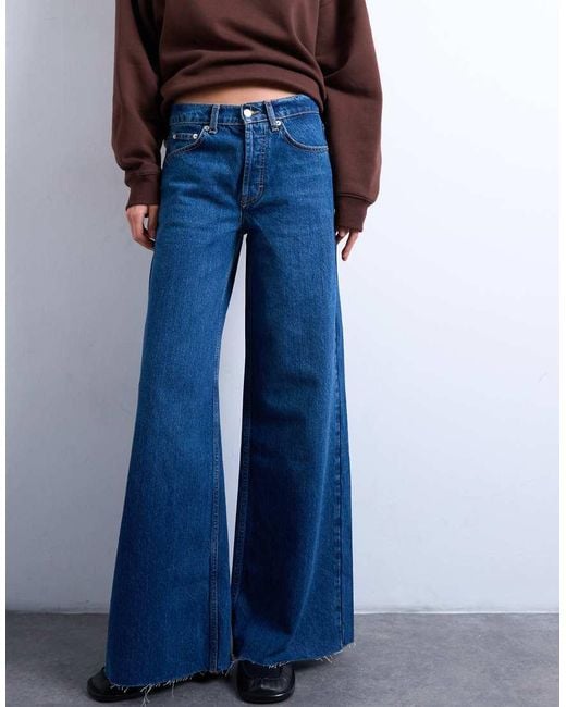 TOPSHOP Blue Horizon Mid Rise Wide Leg Jean With Raw Hem