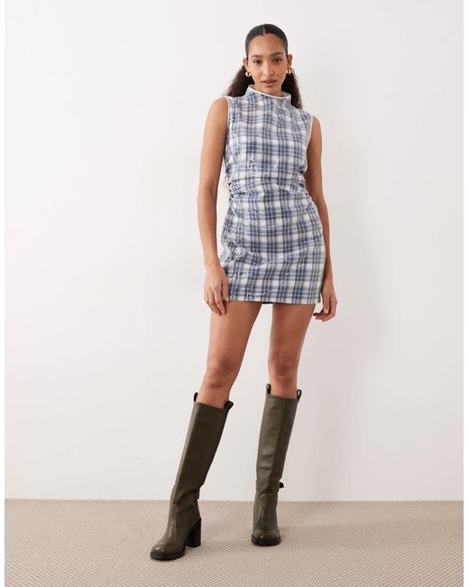 Maya - robe courte et sans manches ornée Ghospell en coloris Blue