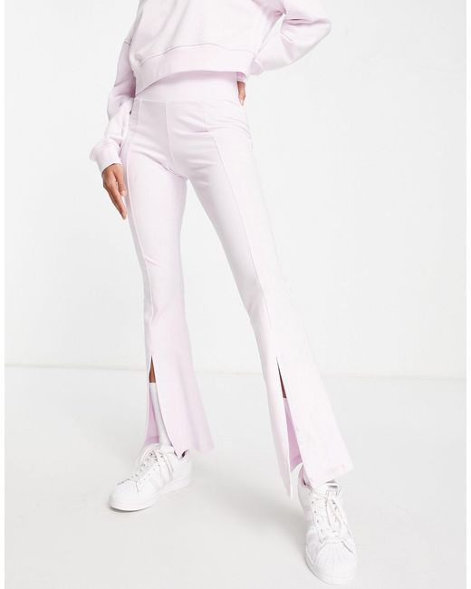 Pantaloni a zampa con spacco sul davanti stile aerobica anni '80 di adidas  Originals in Bianco | Lyst