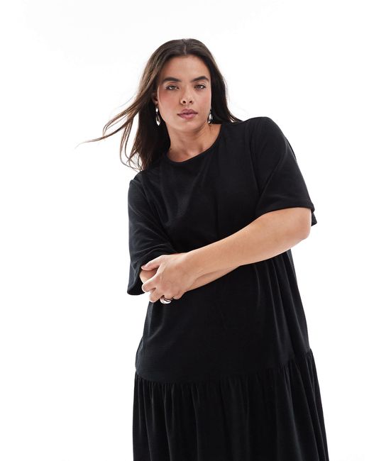 Asos design curve - robe mi-longue évasée en velours à larges côtes et nouée dans le dos ASOS en coloris Black