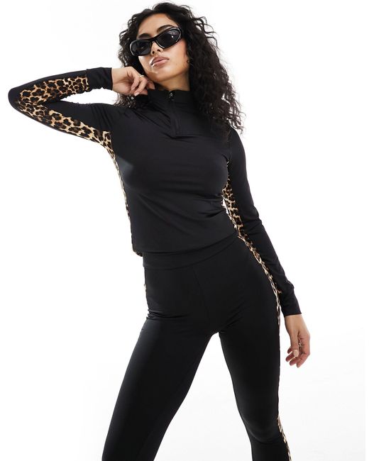 Completo da sci con top base layer e leggings neri con stampa leopardata a contrasto di Threadbare in Black