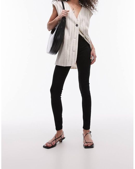 Vaqueros De Corte Superpitillo Y Talle Alto Joni De TOPSHOP de color Black
