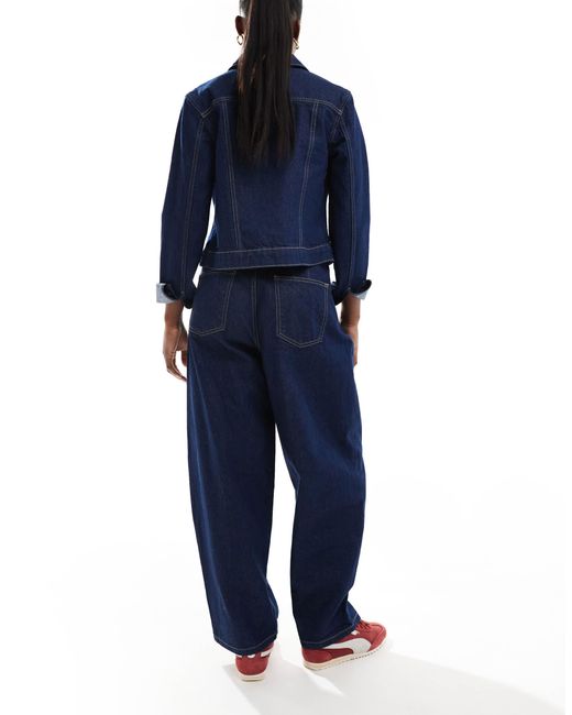 Jean bouffant avec ceinture nouée à la taille - délavage brut ASOS en coloris Blue