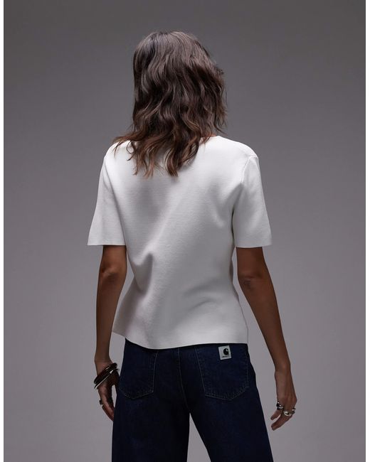 Gilet à manches courtes et col v en maille compacte avec boutons dorés Mango en coloris Gray