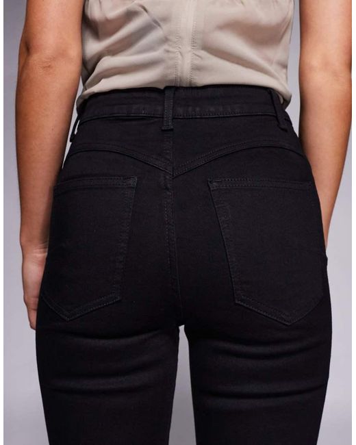 Vaqueros De Campana Negros Muy Elásticos Moldeadores De Asos Design Petite ASOS de color Black