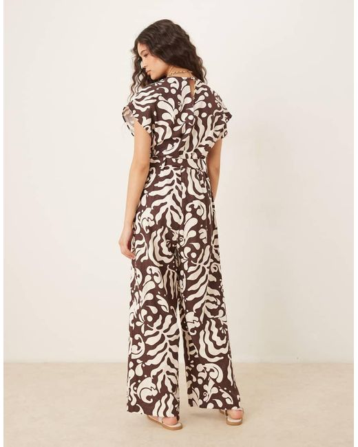 Mango Jumpsuit Met V-Hals, Riem En Bloemenprint in het Natural