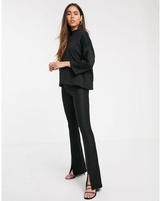 Stradivarius Black Ribbed Jersey Flare Trousers With Slit
