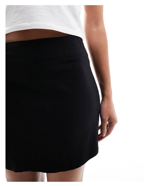 Minifalda muy corta negra con lazada lateral y detalle plisado Daisy Street de color Black