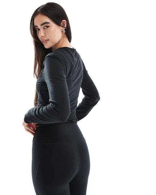 Top Holgado Y Cruzado De Manga Larga Dri-Fit De Nike One Training Nike de color Black