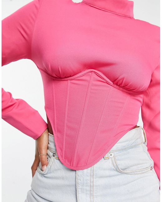 Simmi - top corset à col montant SIMMI en coloris Pink