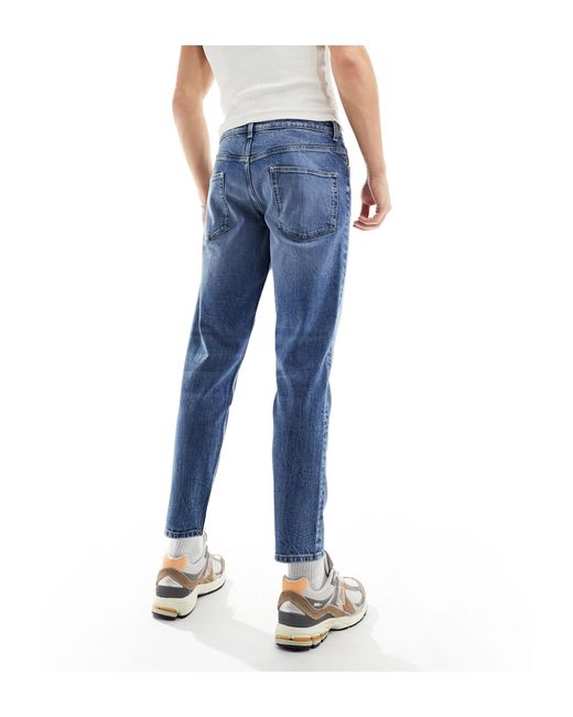 Jeans stretch affusolati lavaggio medio di ASOS in Blue da Uomo