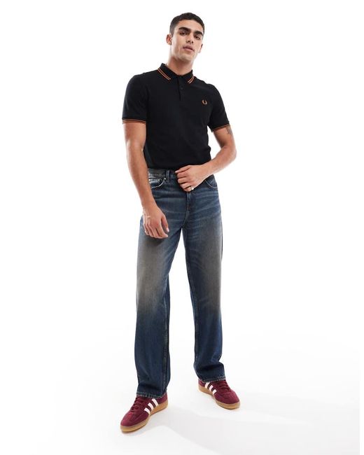 Polo Con Doppia Riga A Contrasto Sui Bordi Nera E Arancione di Fred Perry in Blue da Uomo