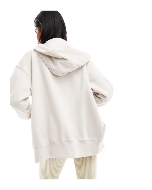 Sweat à capuche oversize zippé en polaire avec petit logo virgule - marron minerai clair Nike en coloris White