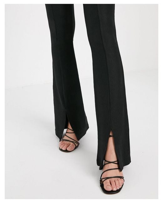Pantalon negro campana stradivarius hot sale