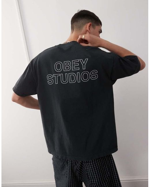 Camiseta Auténtico Pigmentado Con Estampado Gráfico En El Pecho Y La Espalda De Logo Studios De Obey de hombre de color Black