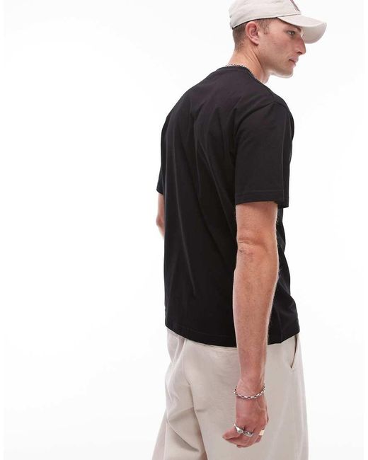 Camiseta Negra Con Gráfico Del Logo De Wwr Caterpillar de hombre de color Black