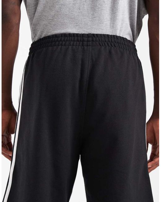 Adidas Originals Gray Three Stripe Shorts for men