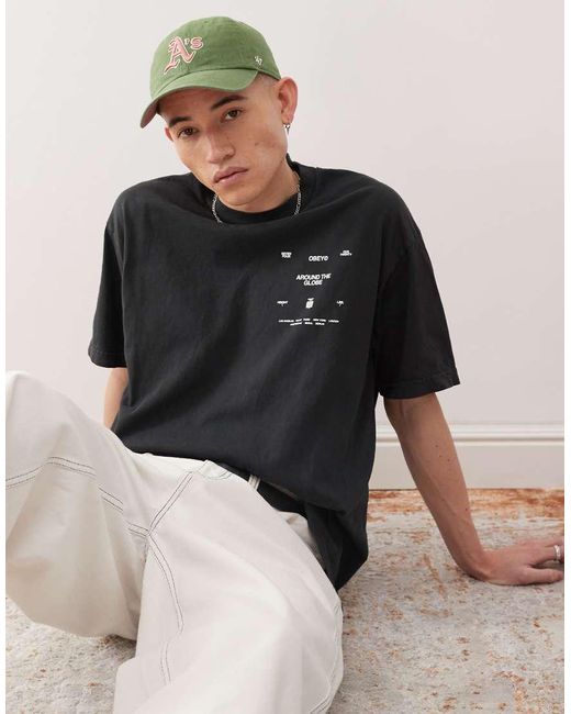 Camiseta Negro Auténtico Envejecido Pigmentado Con Estampado Gráfico En La Espalda Around The Globe De Obey de hombre de color Black
