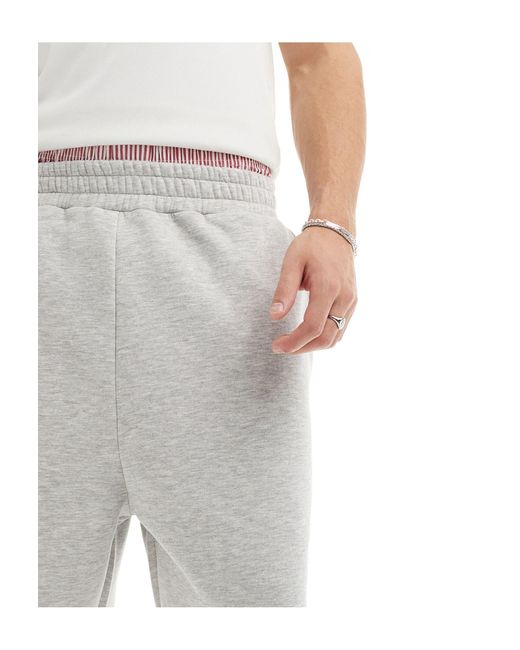 Pantaloncini della tuta unisex ampi di Reclaimed (vintage) in White
