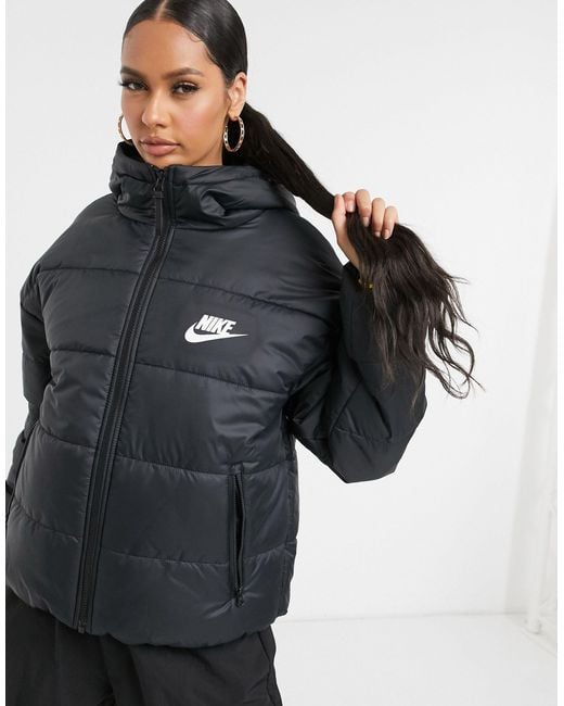 Nike Padded Jacket With Back Swoosh in Black | Lyst