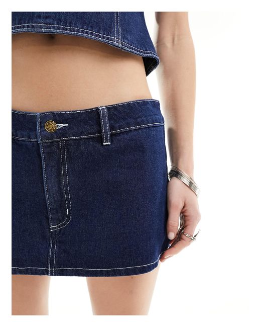 Mini-jupe d'ensemble en jean à taille basse - délavage indigo Lioness en coloris Blue