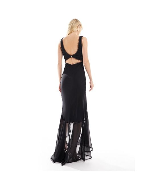 Asos design tall - robe longue effilochée coupée en biais à décolleté plongeant avec ourlet asymétrique et boucle au dos ASOS en coloris Black